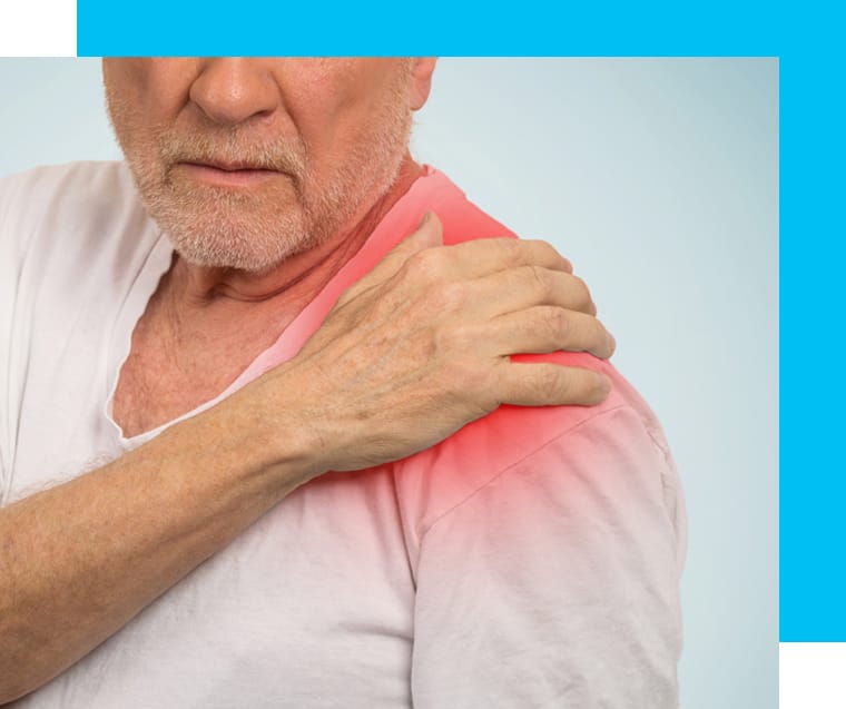 A close-up shot of a patient holding his shoulder in pain.
